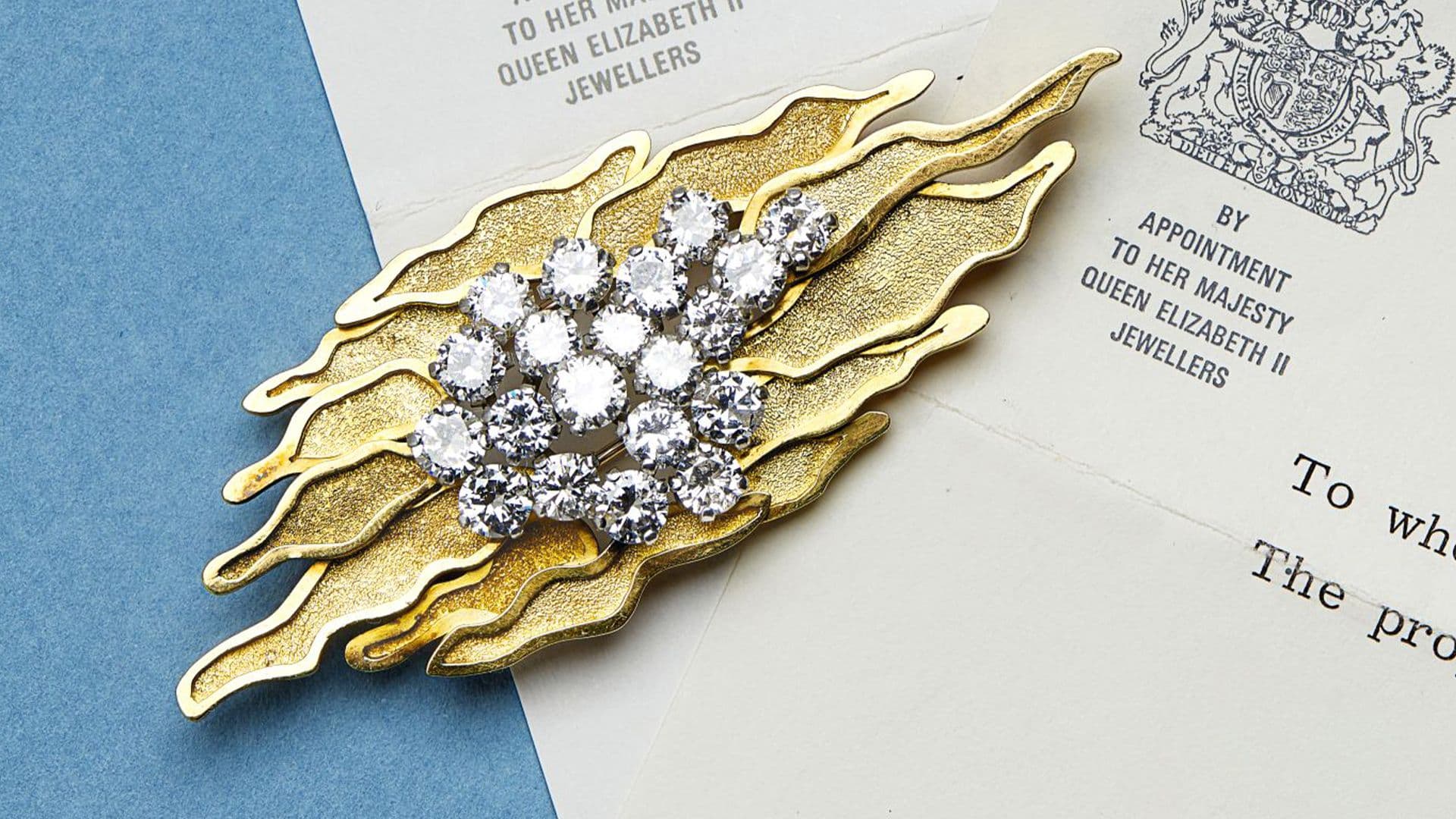 A DIAMOND-SET PENDANT/BROOCH, ANDREW GRIMA | Sold for £10,000*