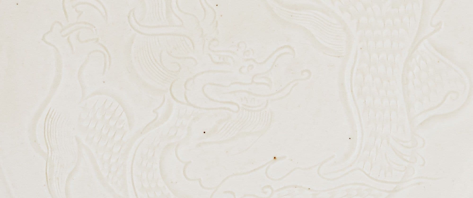 DING WHITE-GLAZED 'DRAGON' DISH | NORTHERN SONG-JIN DYNASTY, 11TH-12TH CENTURY